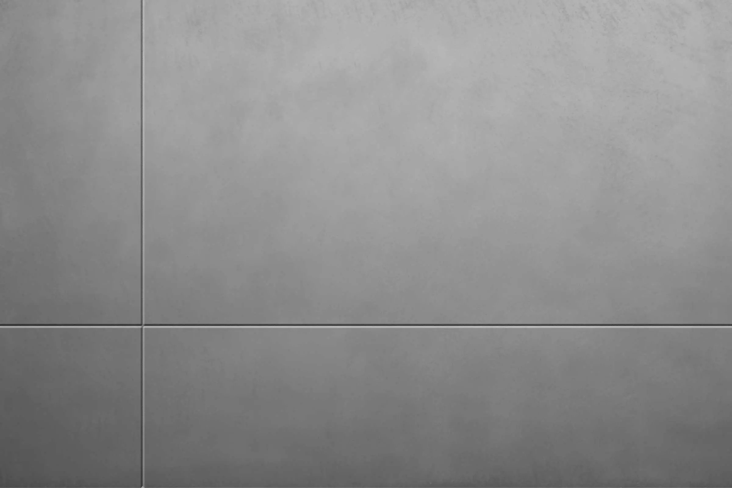 Zunanji omet z videzom betona StoSignature, siva površina ometa z značilnostjo vidnega betona